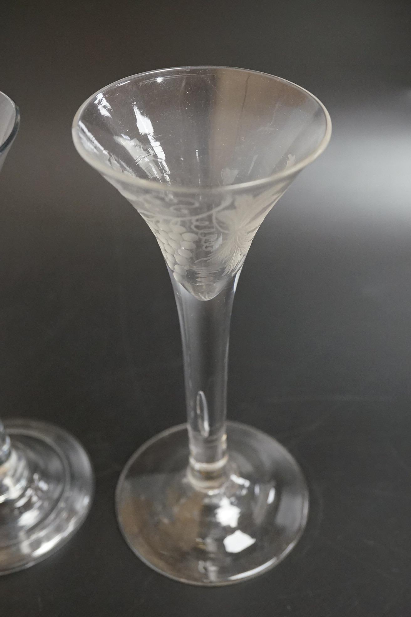 Two 18th century glass wine flutes, one with folded foot, tallest 16cm high